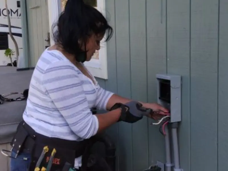 Licensed electrician wiring an exterior subpanel in Iowa Park