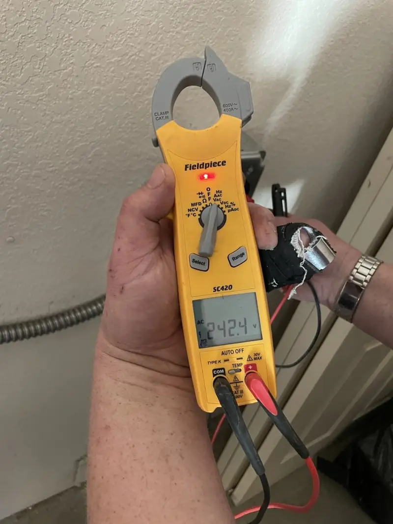 Voltage testing with clamp meter during Generator Installation in Iowa Park